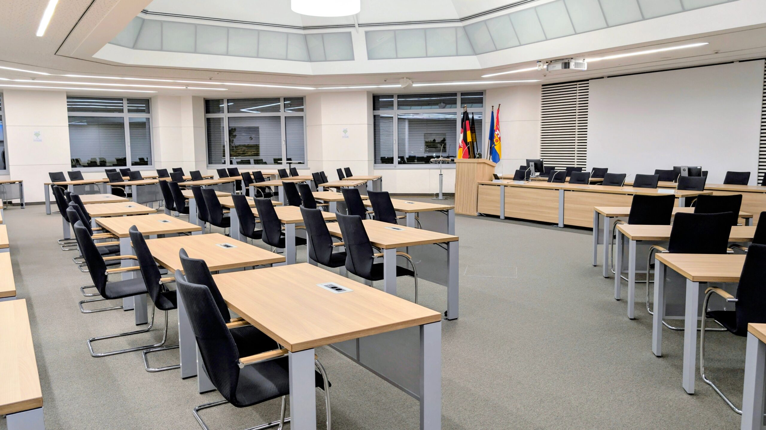 An empty conference room set up for a community meeting.